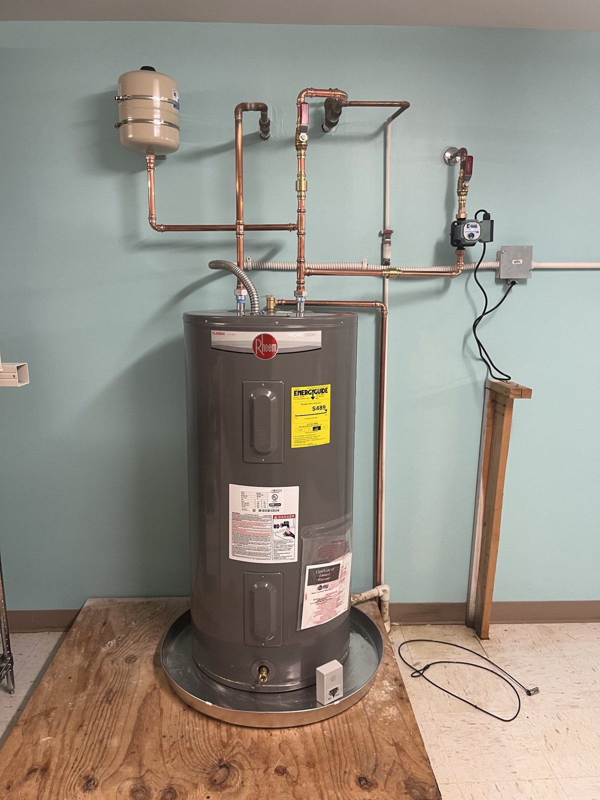 New electric tank water heater with an expansion tank and copper lines