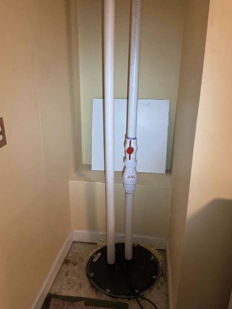 Sewage ejector basin with a sealed lid and new discharge piping
