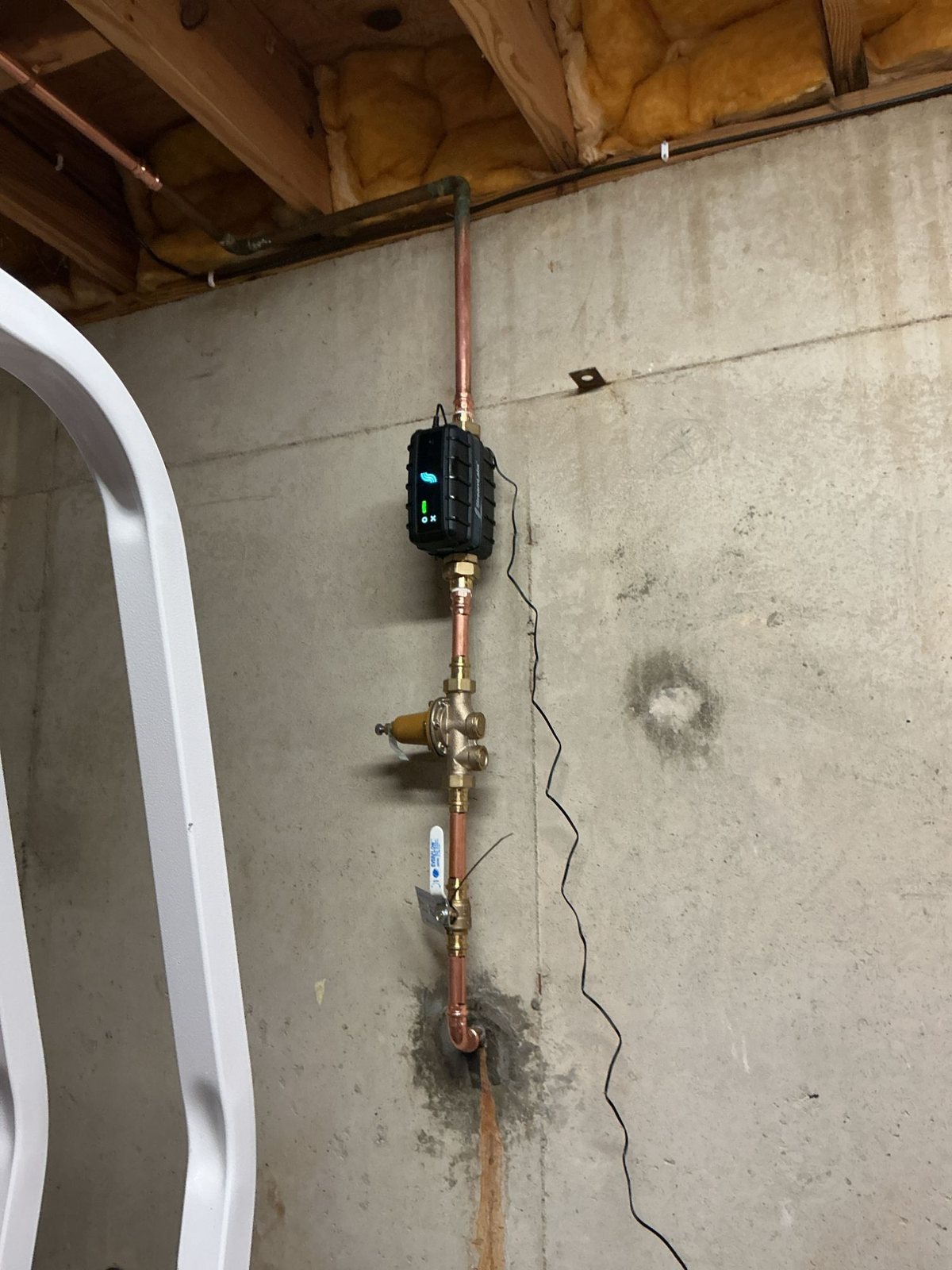 Automatic water shut-off valve and pressure reducing valve on a copper main water line