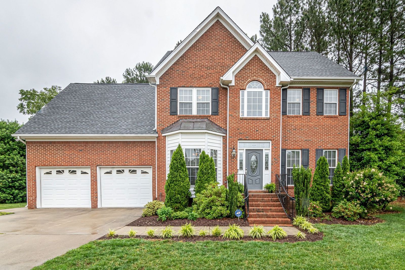 Brick two-story home with a double garage